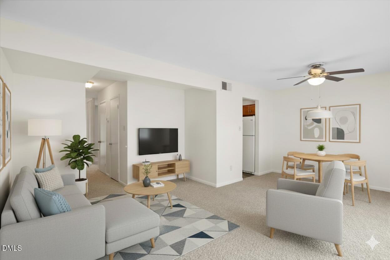 1748 Quail Ridge Road Raleigh, NC 27609 - Photo 17 of 36 a living room with furniture and a flat screen tv