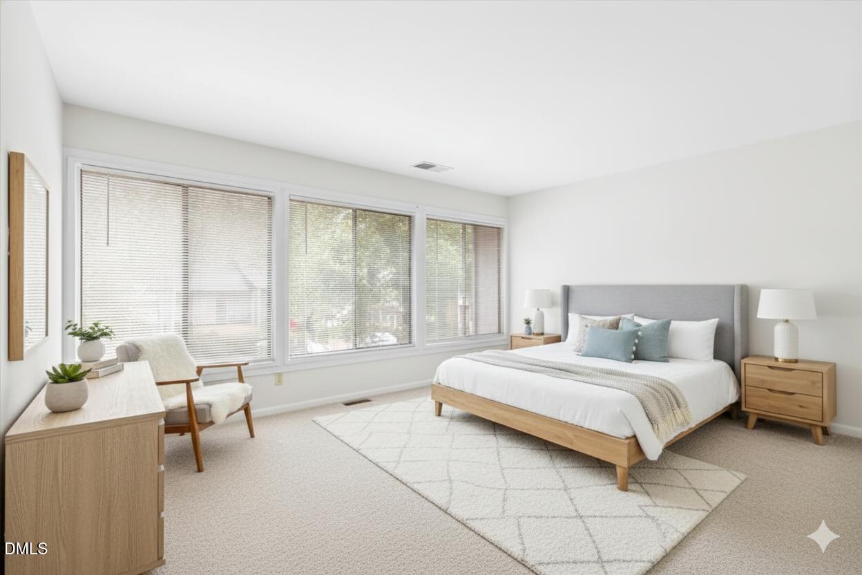 1748 Quail Ridge Road Raleigh, NC 27609 - Photo 22 of 36 a bedroom with a bed and large windows