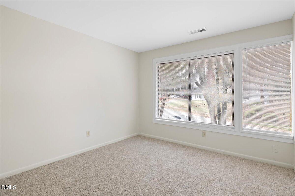 1748 Quail Ridge Road Raleigh, NC 27609 - Photo 28 of 36 an empty room with a window