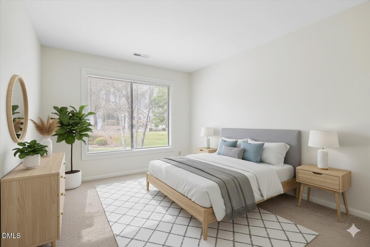 1748 Quail Ridge Road Raleigh, NC 27609 - Photo 30 of 36 a bedroom with a bed and a window