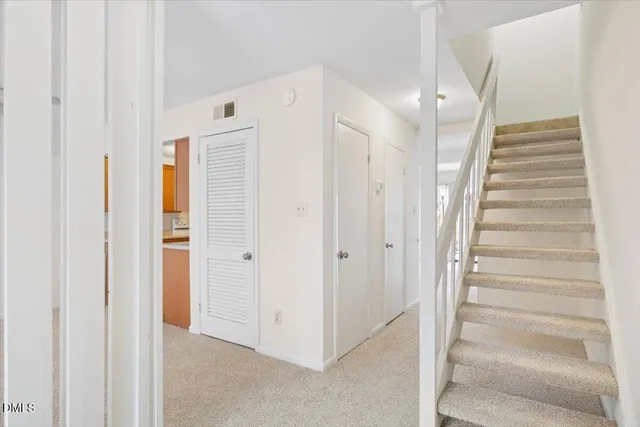 front view of a brick house with a large windows