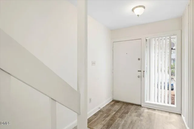 a view of a hallway with hallway and stairs