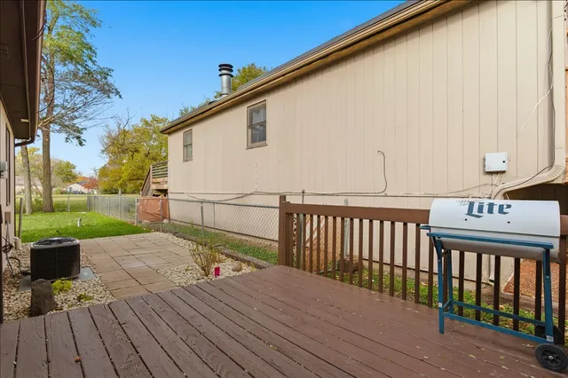 a view of a deck with wooden floor and outdoor space