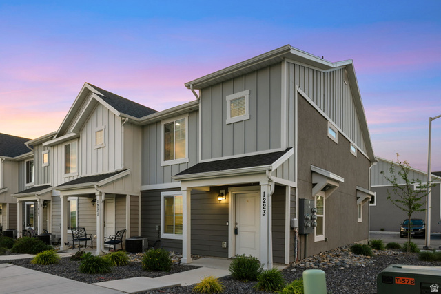 1223 East 1775 North Payson, UT 84651 - Photo 13 of 45 Contemporary townhouse exterior featuring a covered entry, mixed siding, and a gabled roofline