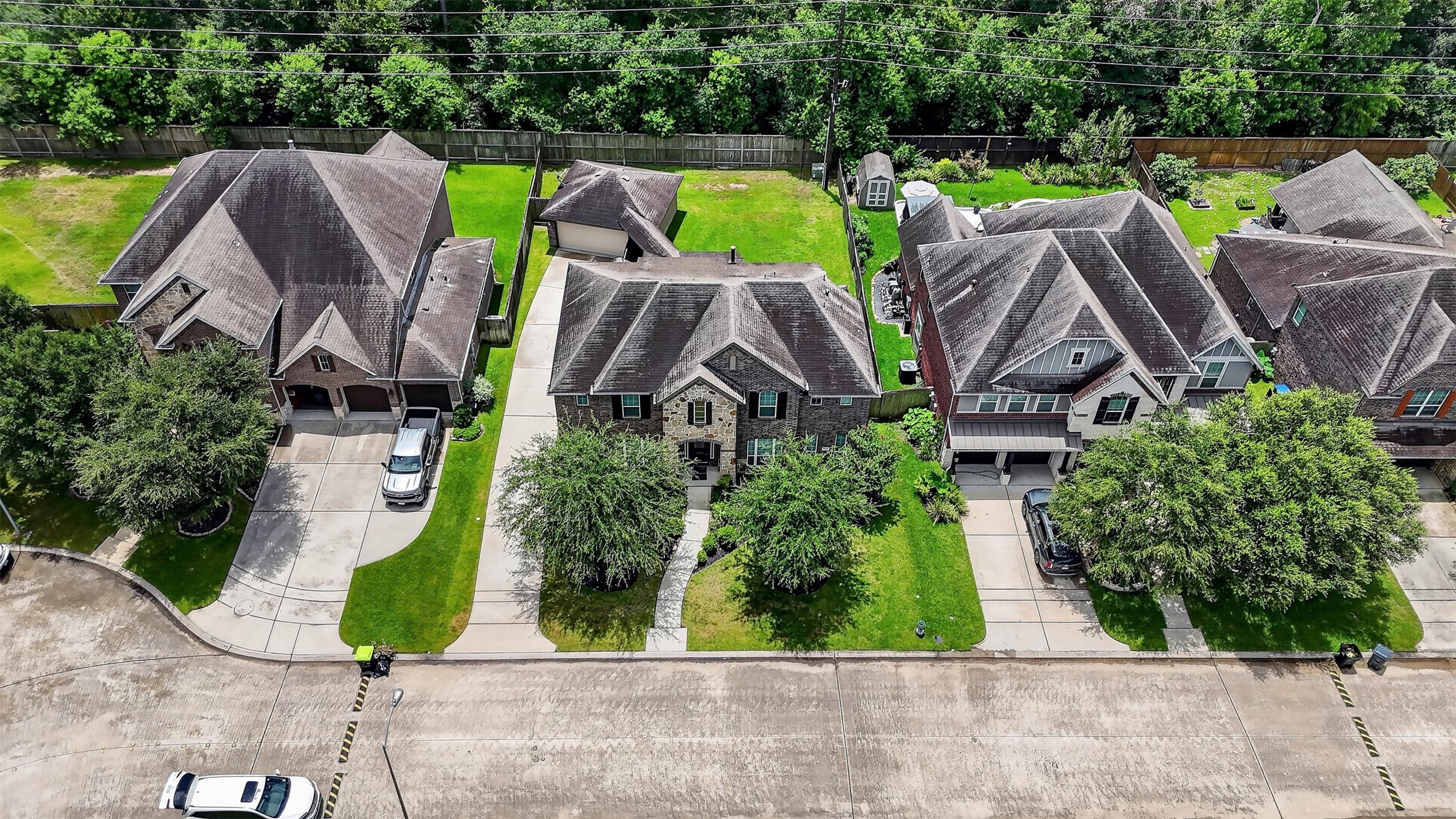 6234 Avon Landing Lane Spring, TX 77379 - Photo 45 of 49 Another aerial view of the home in relation to the neighborhood homes as well as showing the tree lined backyard with no rear neighbors.