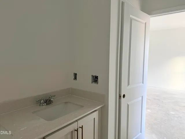 a bathroom with a sink and vanity