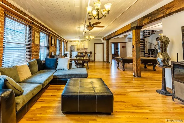 a kitchen with stainless steel appliances a refrigerator sink and microwave