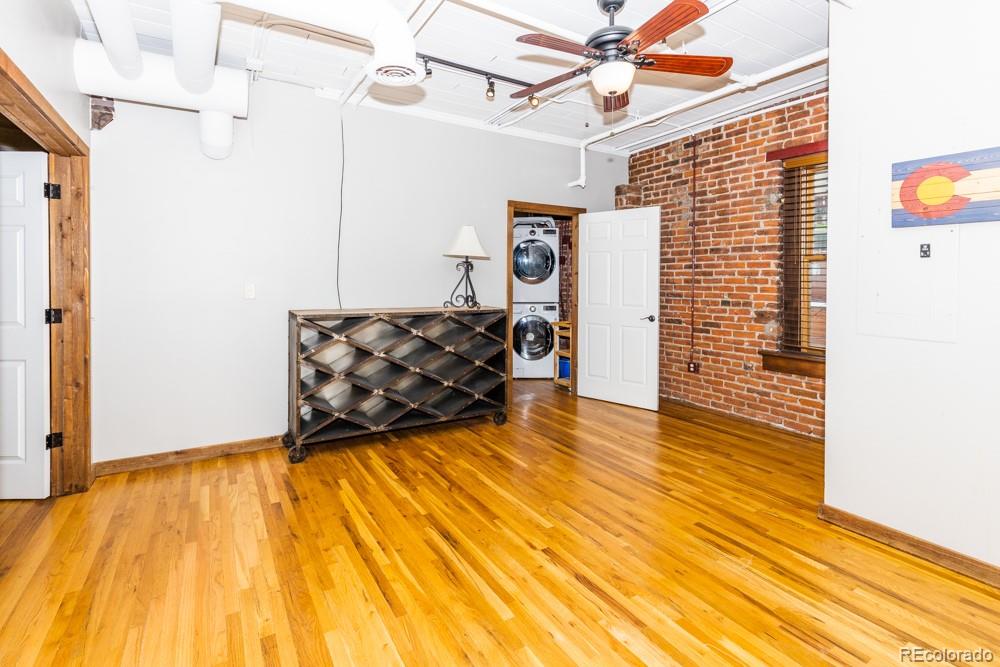 1940 Blake Street, Unit 301 Denver, CO 80202 - Photo 16 of 25 a view of a room with wooden floor