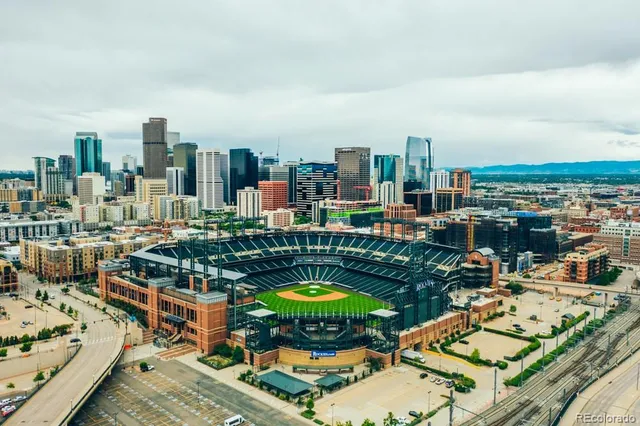 a view of a bedroom with wooden floor and closet
