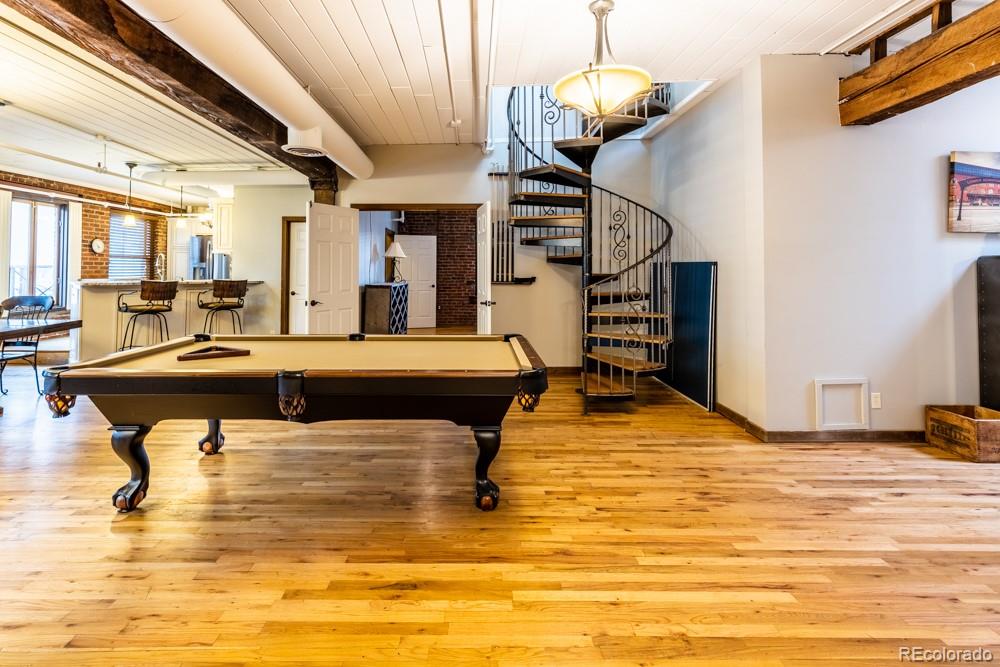1940 Blake Street, Unit 301 Denver, CO 80202 - Photo 9 of 25 a living room with fireplace furniture and a chandelier