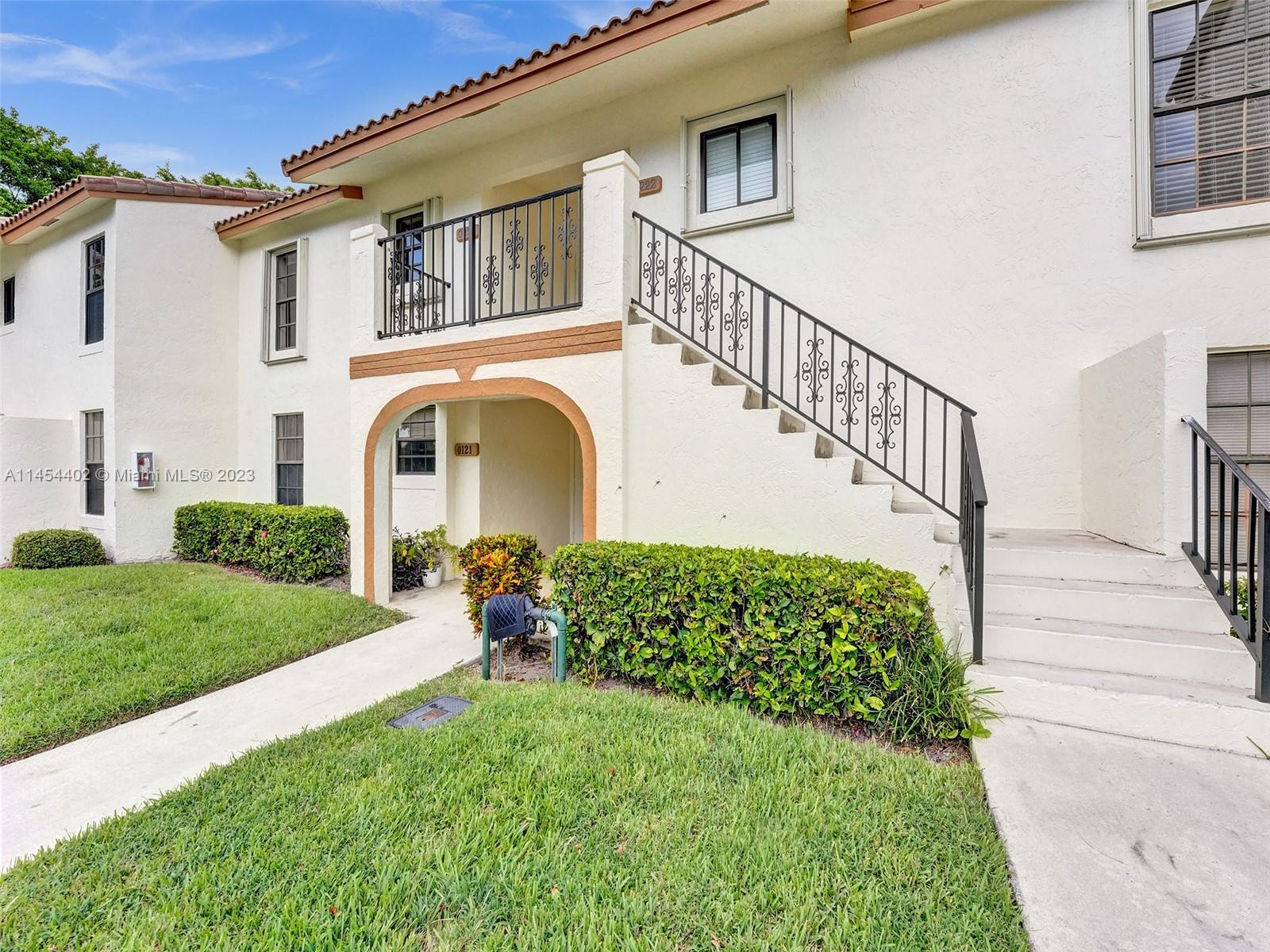 321 Olivewood Place, Unit O221 Boca Raton, FL 33431 - Photo 1 of 56 a front view of a house with garden