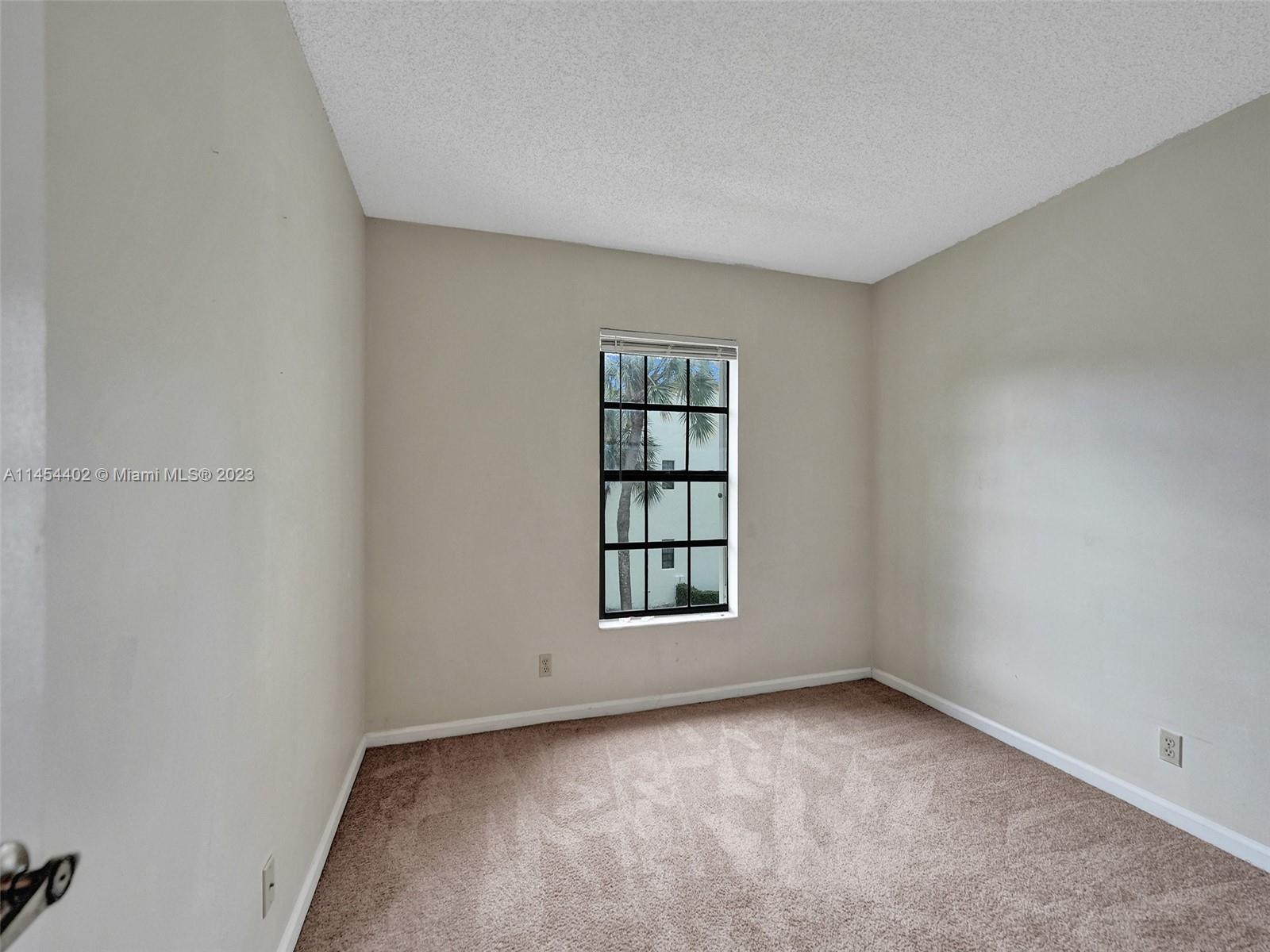 321 Olivewood Place, Unit O221 Boca Raton, FL 33431 - Photo 13 of 56 an empty room with windows