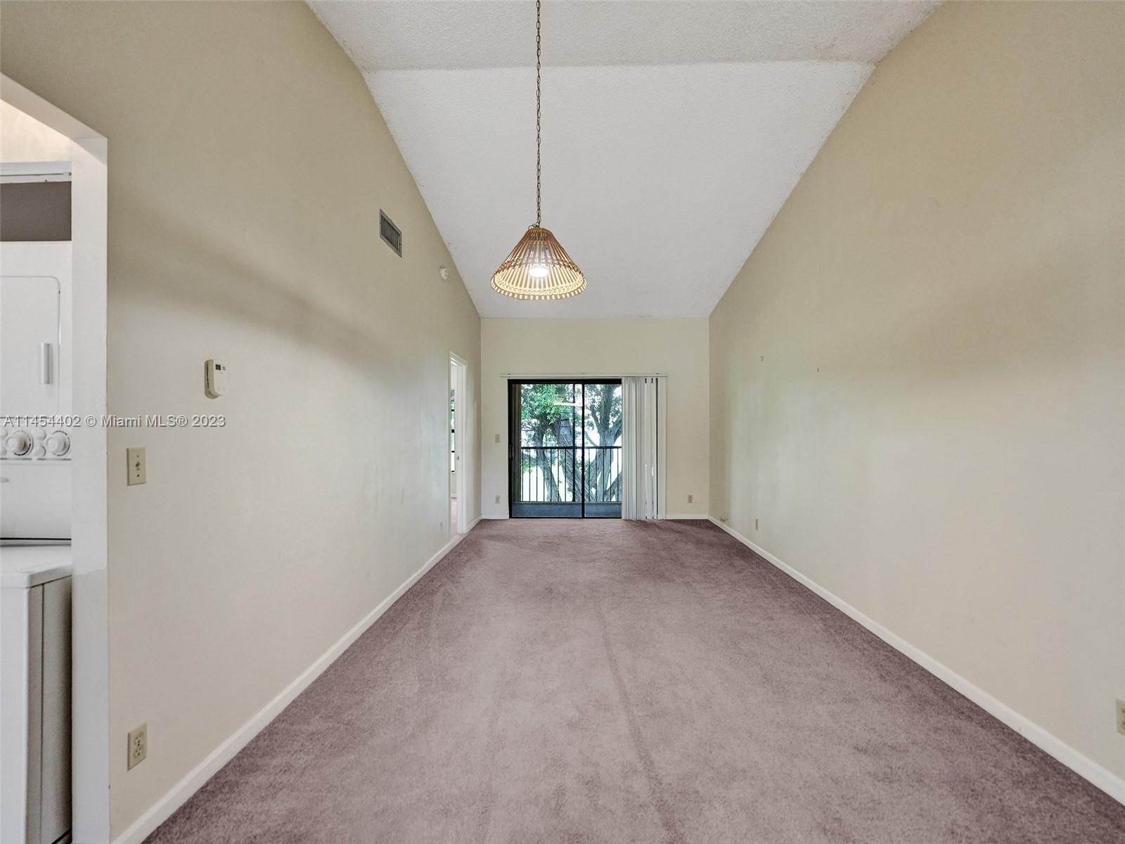 321 Olivewood Place, Unit O221 Boca Raton, FL 33431 - Photo 17 of 56 a view of a room with window and a ceiling fan