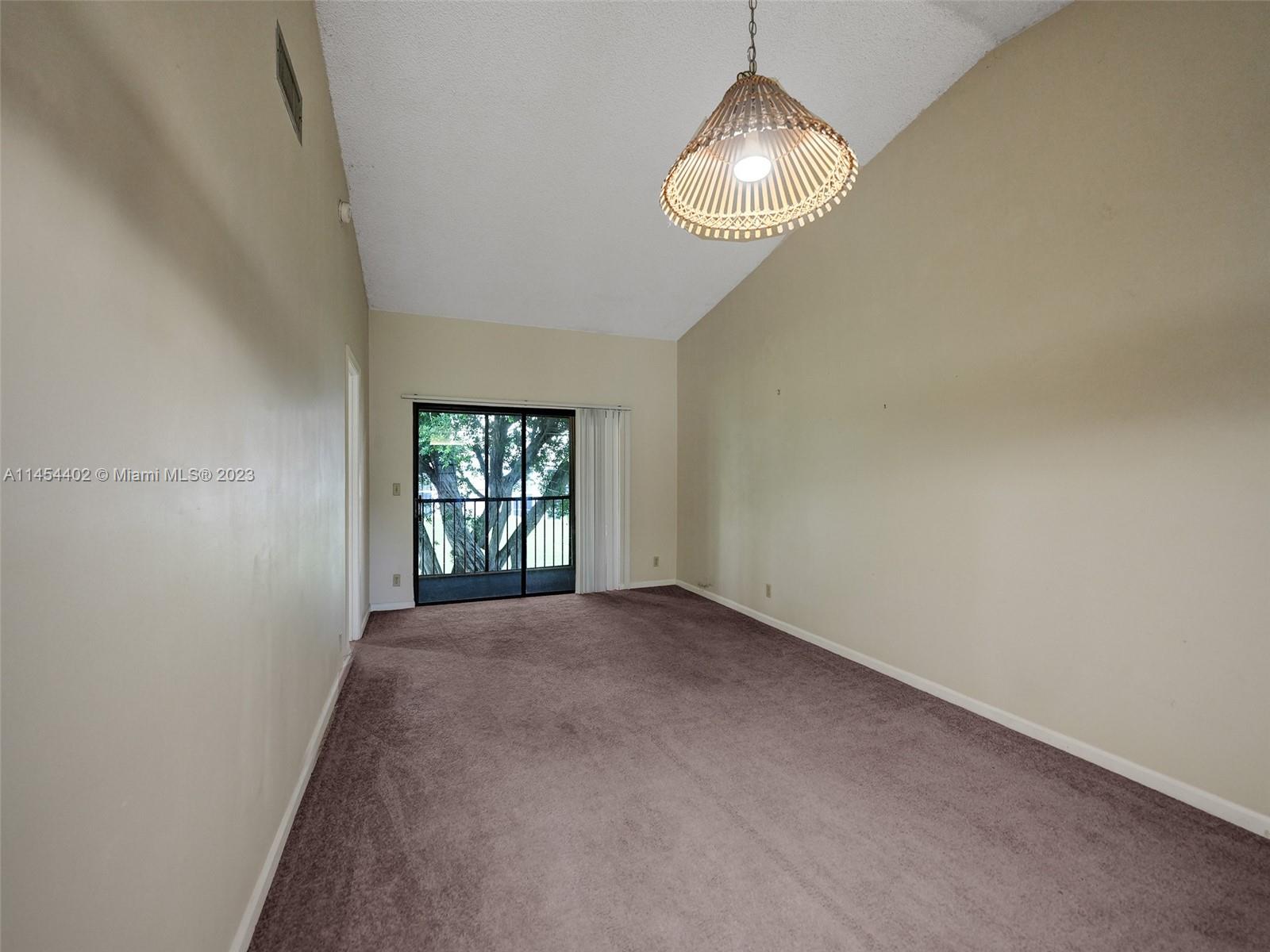 321 Olivewood Place, Unit O221 Boca Raton, FL 33431 - Photo 18 of 56 a view of empty room with windows