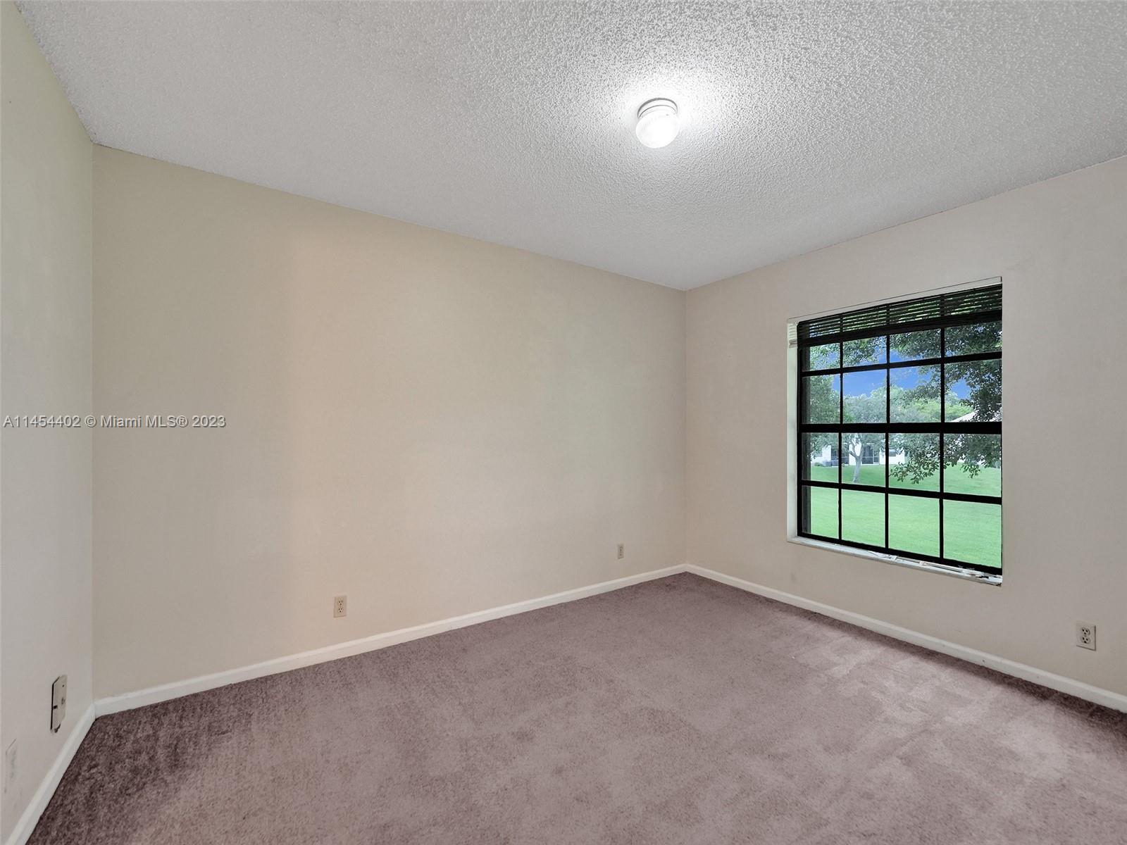 321 Olivewood Place, Unit O221 Boca Raton, FL 33431 - Photo 21 of 56 an empty room with windows