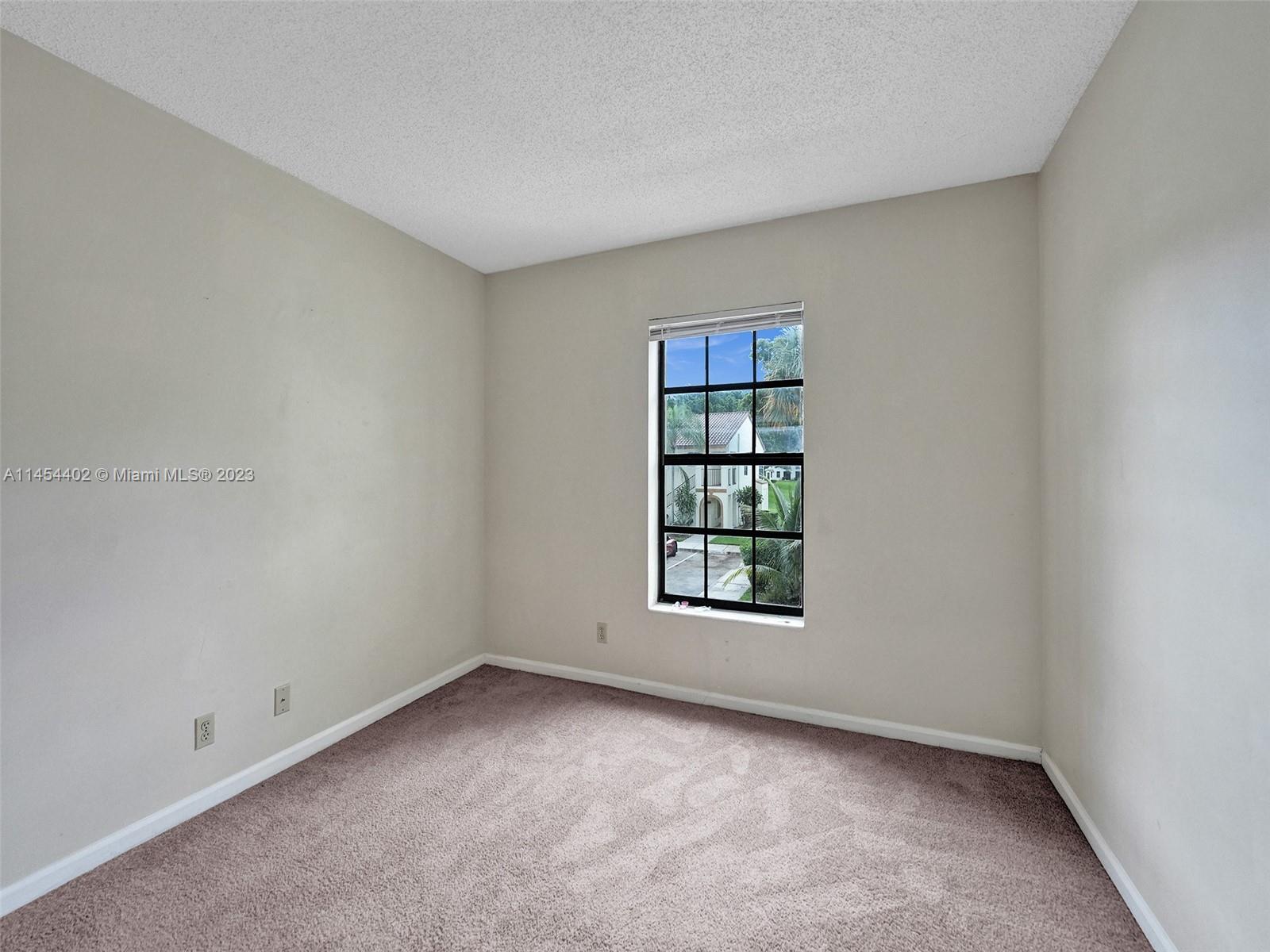 321 Olivewood Place, Unit O221 Boca Raton, FL 33431 - Photo 27 of 56 an empty room with a window