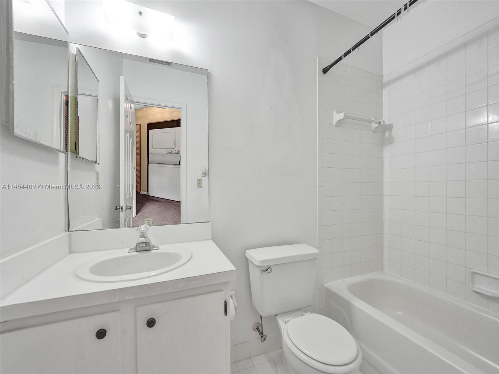 321 Olivewood Place, Unit O221 Boca Raton, FL 33431 - Photo 31 of 56 a bathroom with a sink toilet and shower
