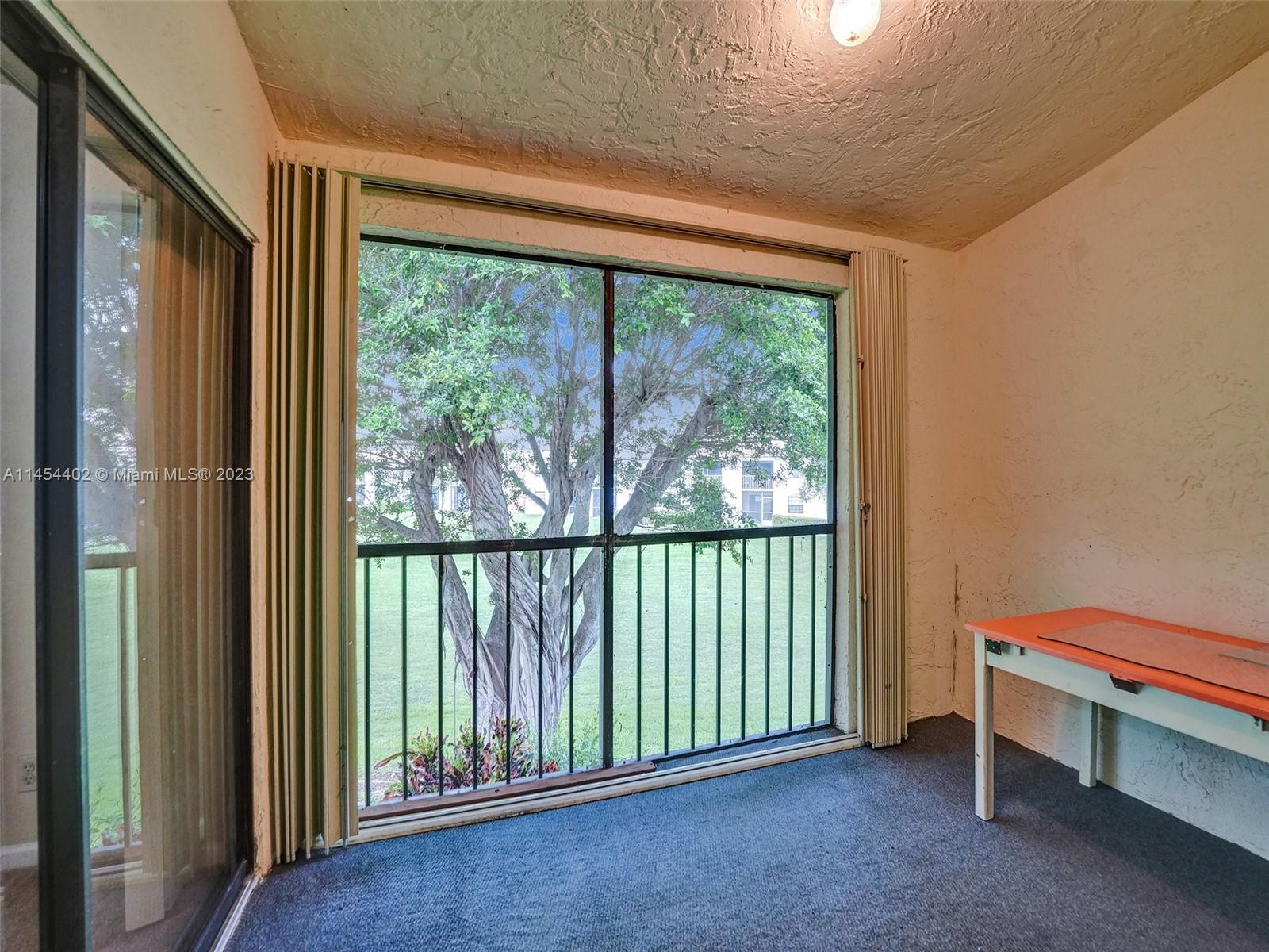321 Olivewood Place, Unit O221 Boca Raton, FL 33431 - Photo 33 of 56 a view of a room with a large window