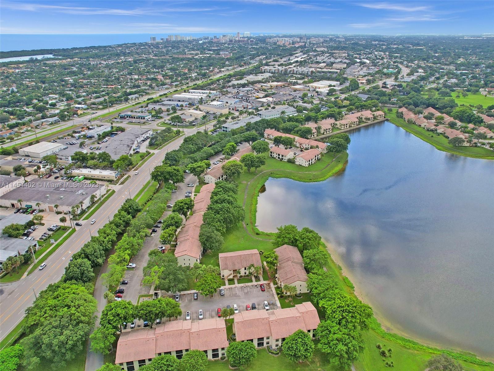 321 Olivewood Place, Unit O221 Boca Raton, FL 33431 - Photo 36 of 56 an aerial view of residential houses with outdoor space