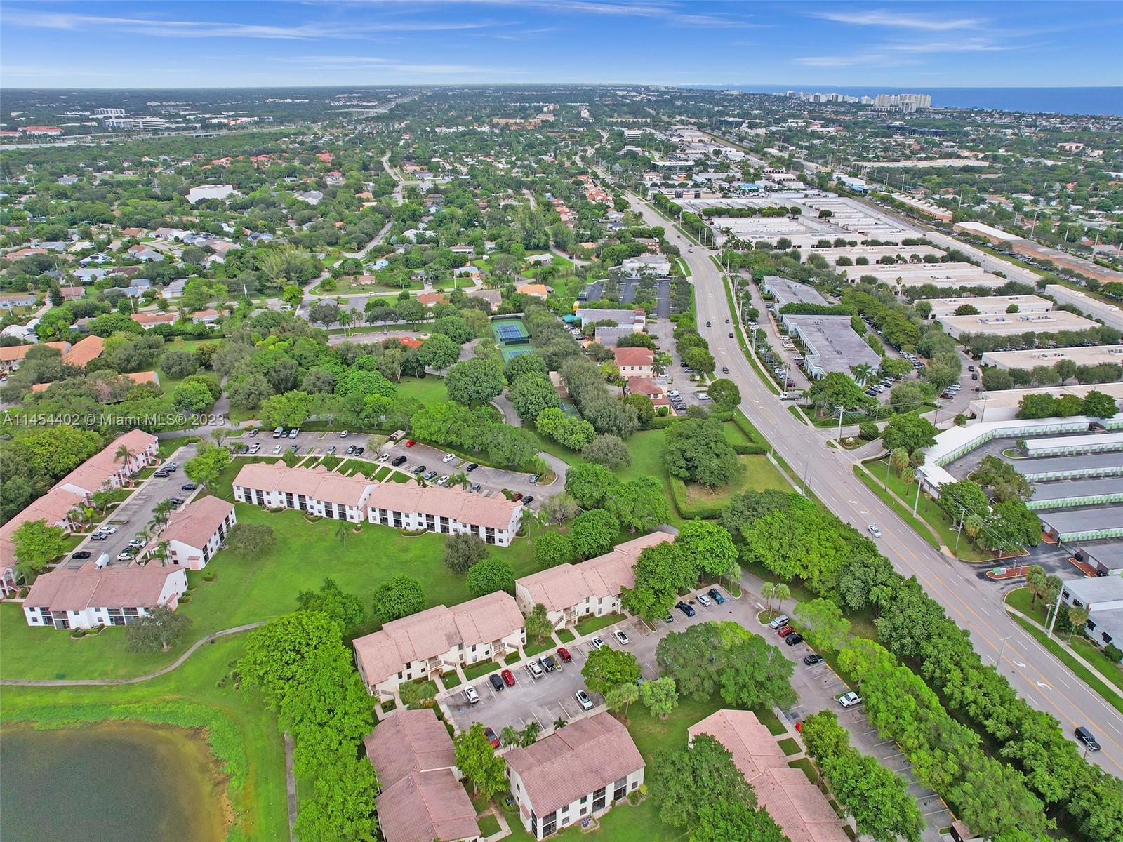 321 Olivewood Place, Unit O221 Boca Raton, FL 33431 - Photo 37 of 56 an aerial view of a city