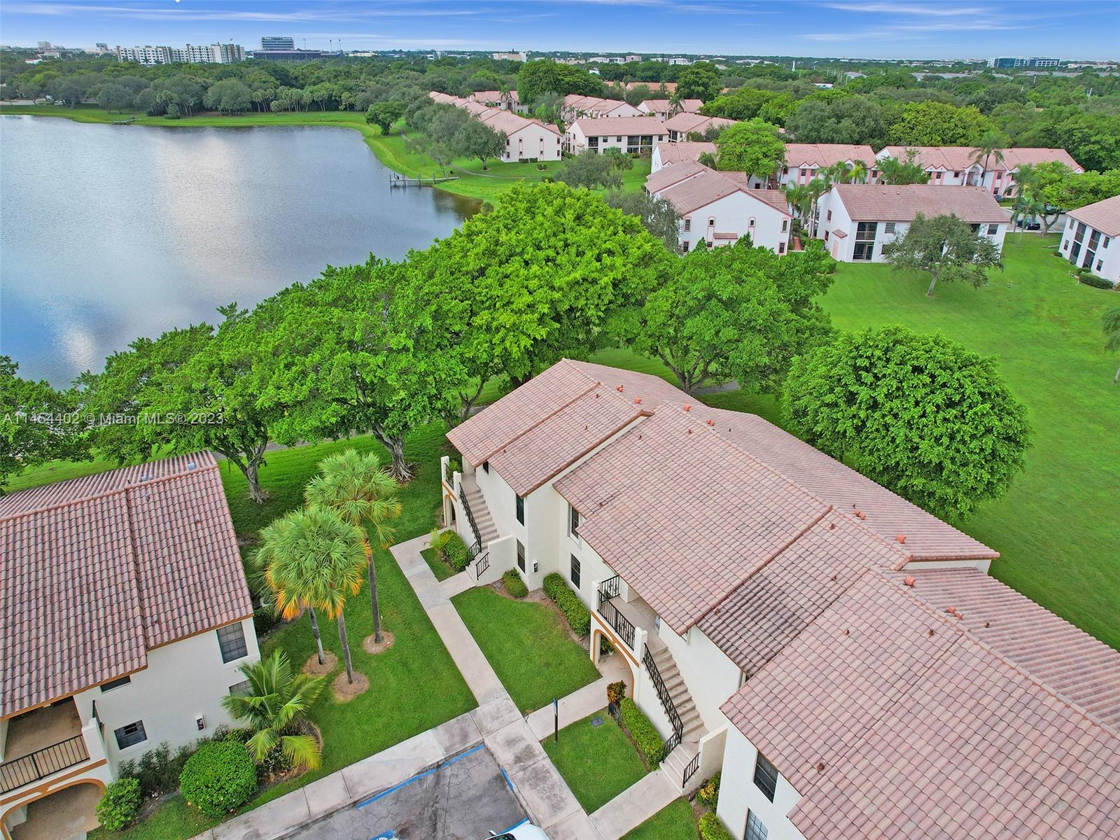321 Olivewood Place, Unit O221 Boca Raton, FL 33431 - Photo 4 of 56 an aerial view of a house with garden space and lake view