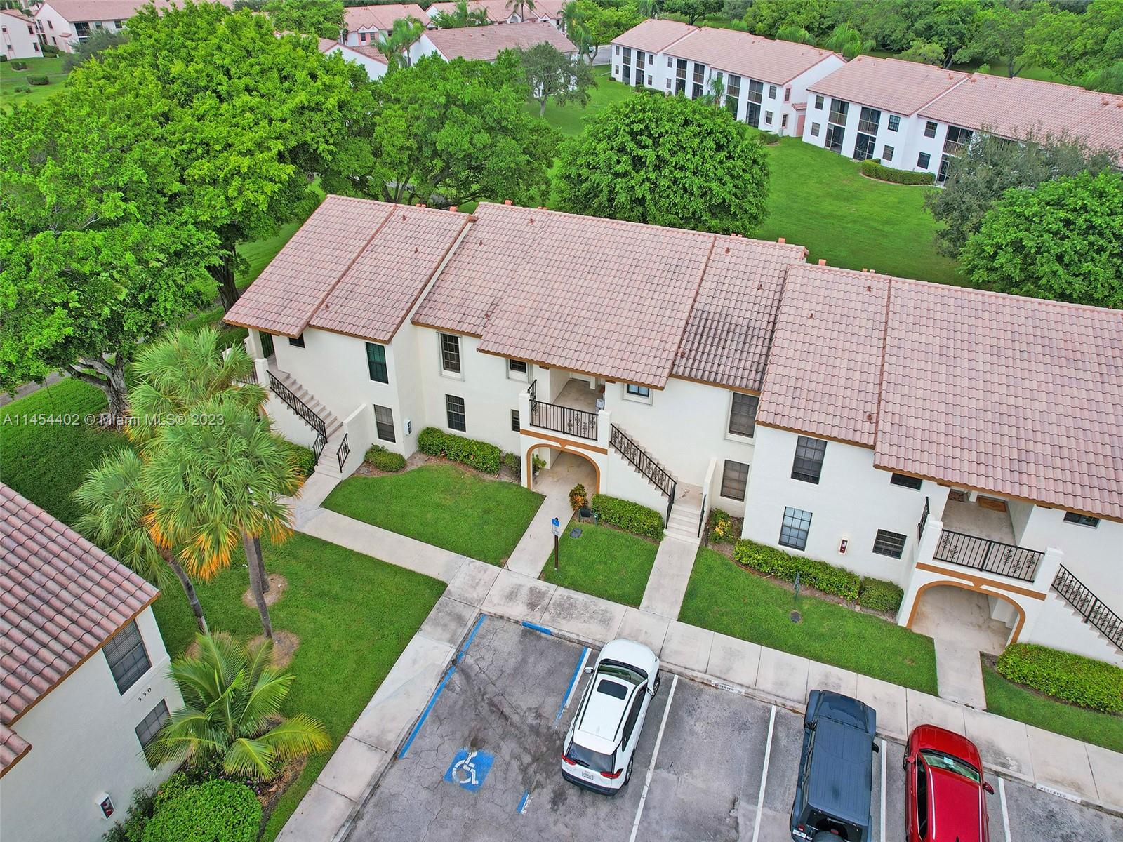321 Olivewood Place, Unit O221 Boca Raton, FL 33431 - Photo 41 of 56 a aerial view of a house with a yard