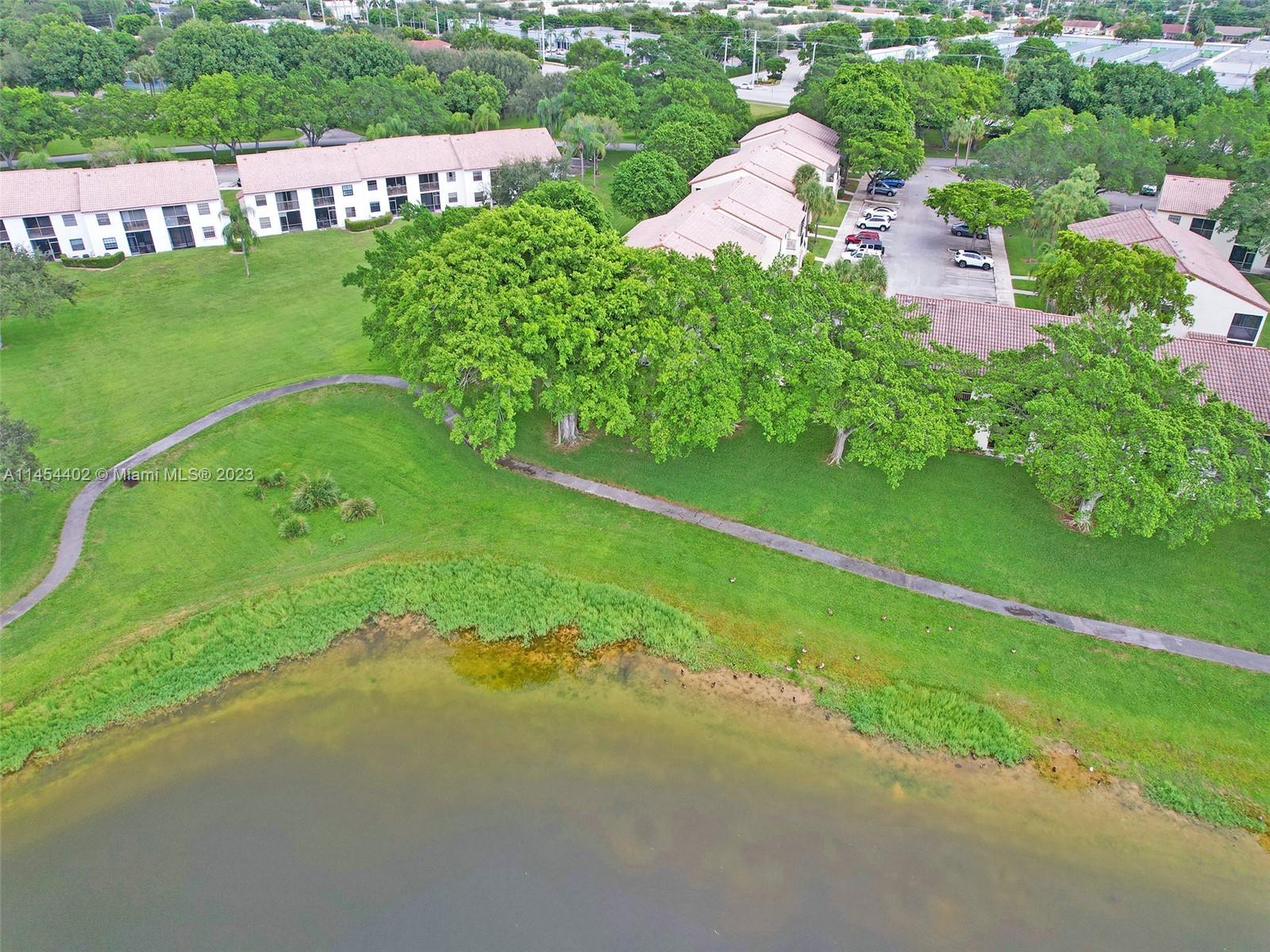 321 Olivewood Place, Unit O221 Boca Raton, FL 33431 - Photo 43 of 56 a view of a street with a park