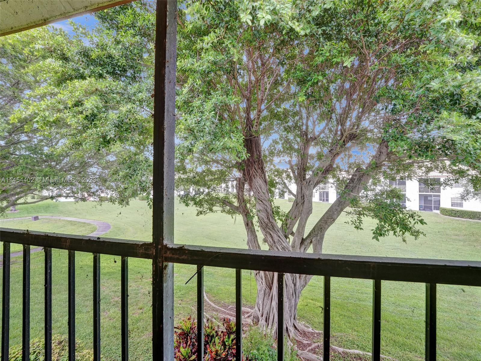 321 Olivewood Place, Unit O221 Boca Raton, FL 33431 - Photo 44 of 56 a view of outdoor with green space