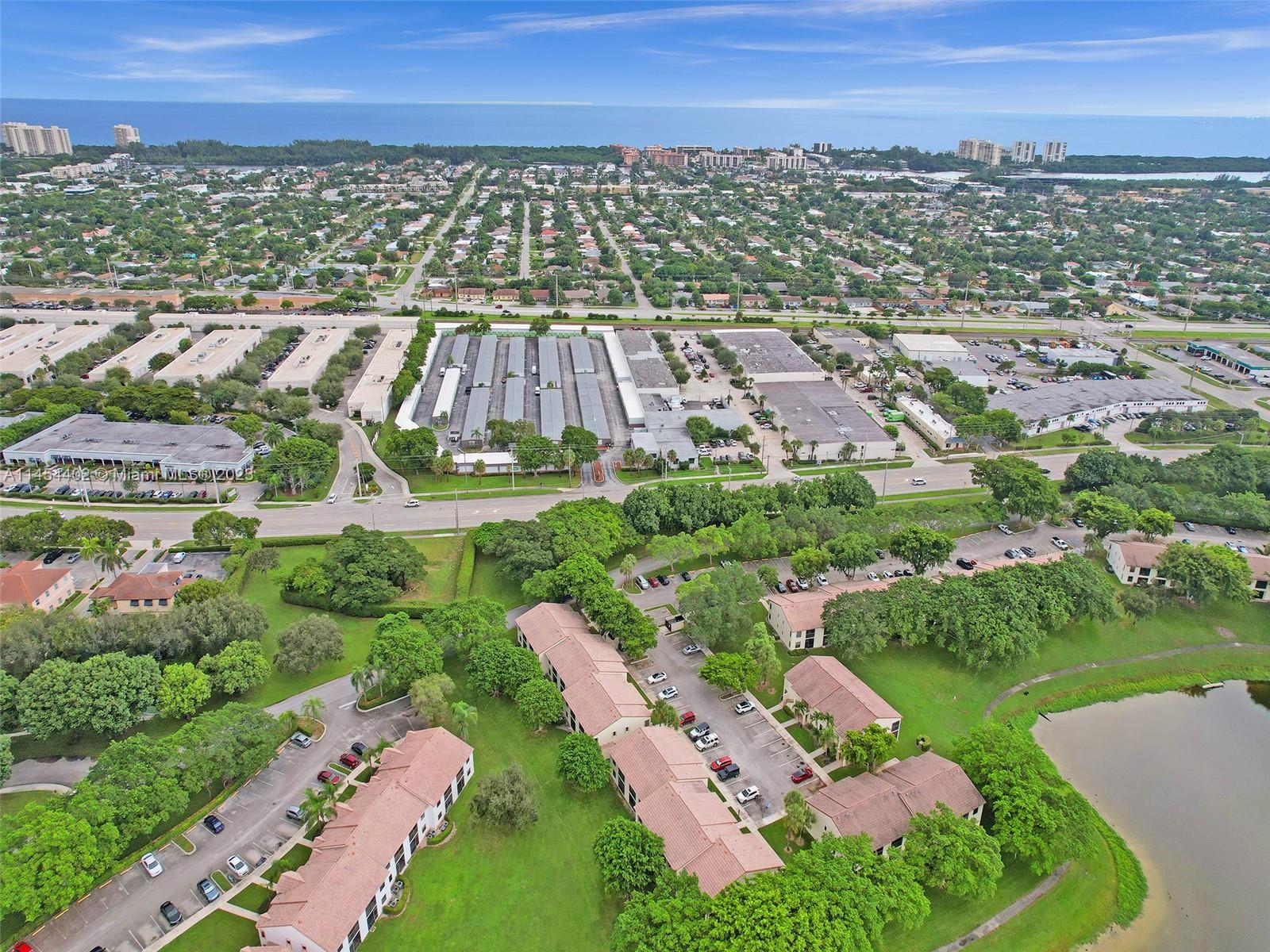 321 Olivewood Place, Unit O221 Boca Raton, FL 33431 - Photo 47 of 56 an aerial view of multiple house