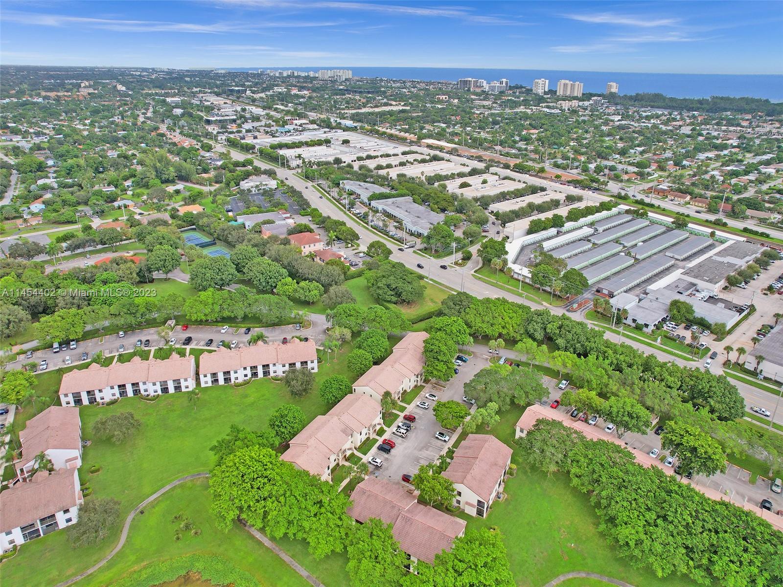 321 Olivewood Place, Unit O221 Boca Raton, FL 33431 - Photo 48 of 56 an aerial view of residential houses with outdoor space