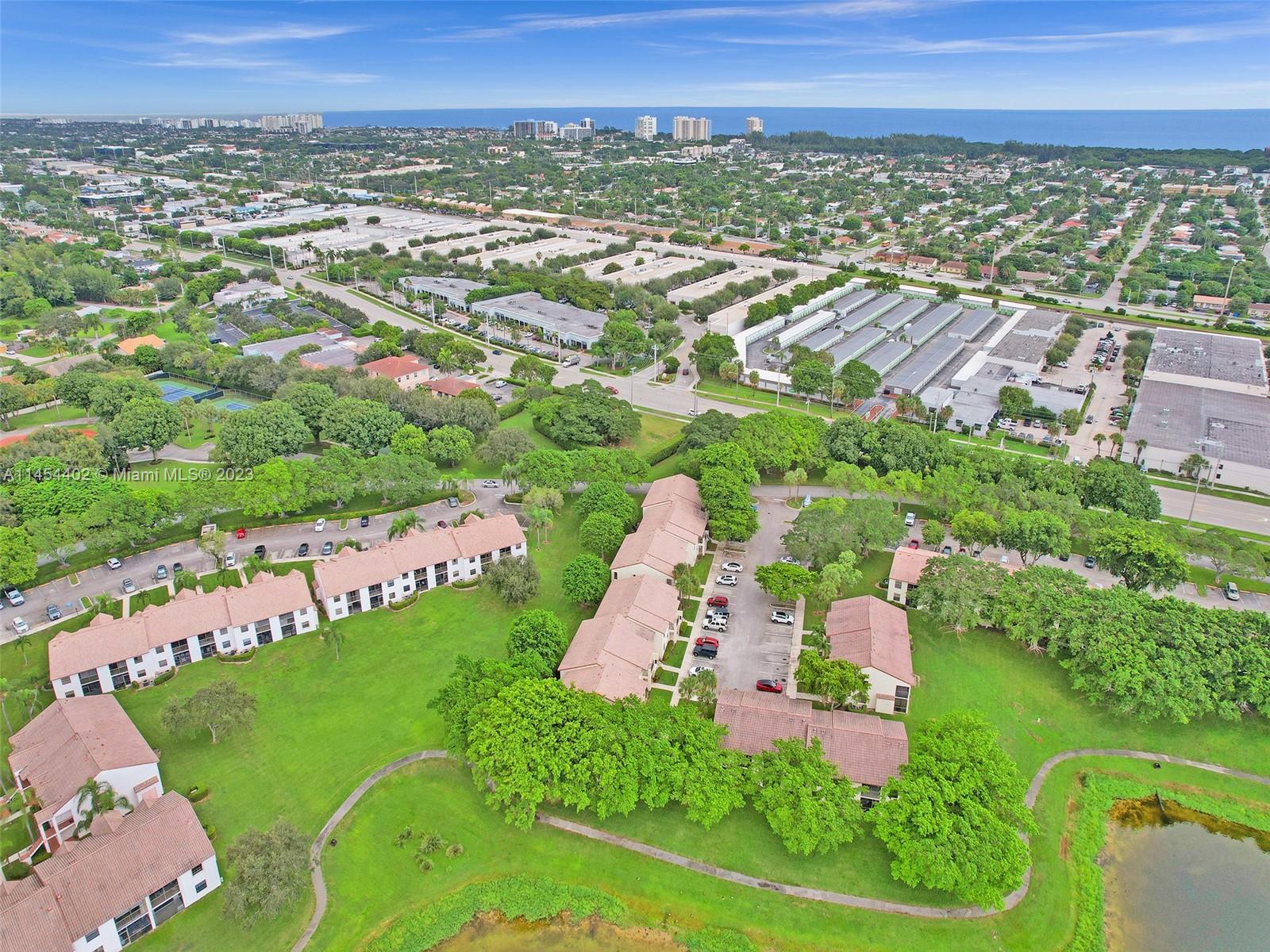 321 Olivewood Place, Unit O221 Boca Raton, FL 33431 - Photo 50 of 56 an aerial view of multiple house