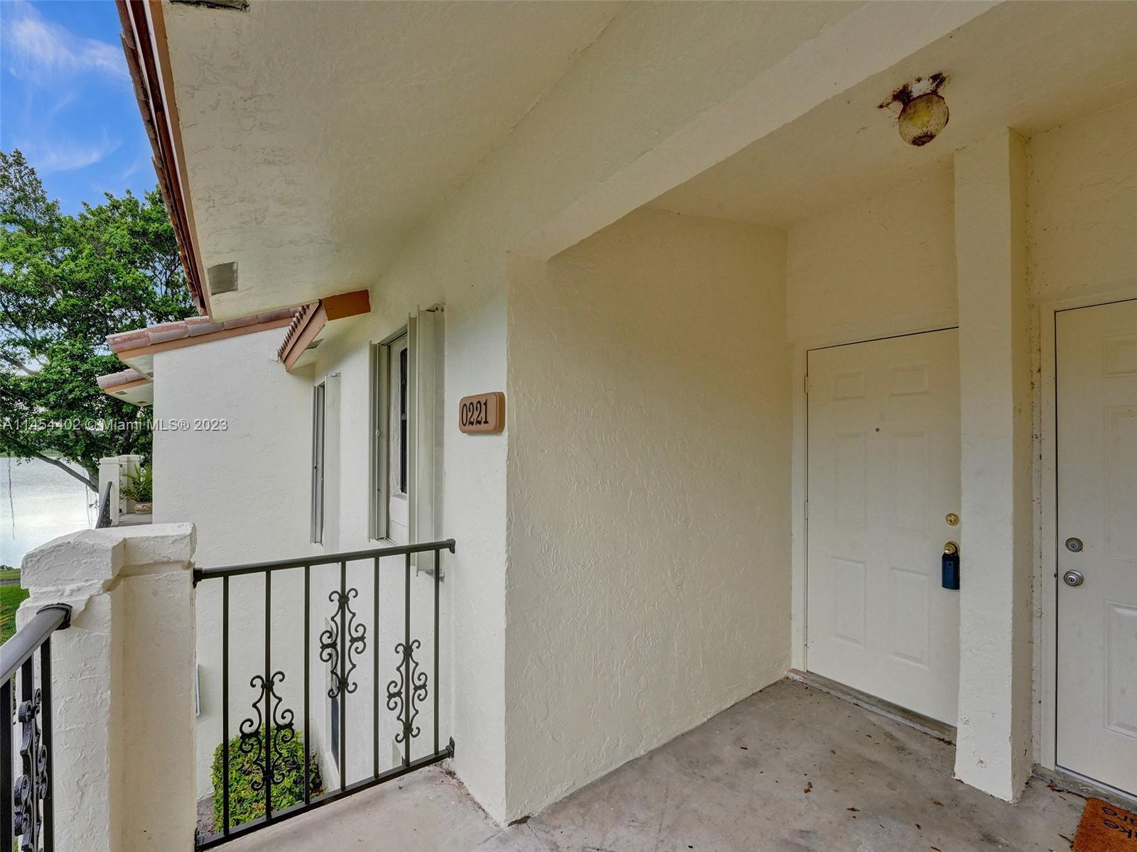 321 Olivewood Place, Unit O221 Boca Raton, FL 33431 - Photo 6 of 56 a view of a house with wooden fence