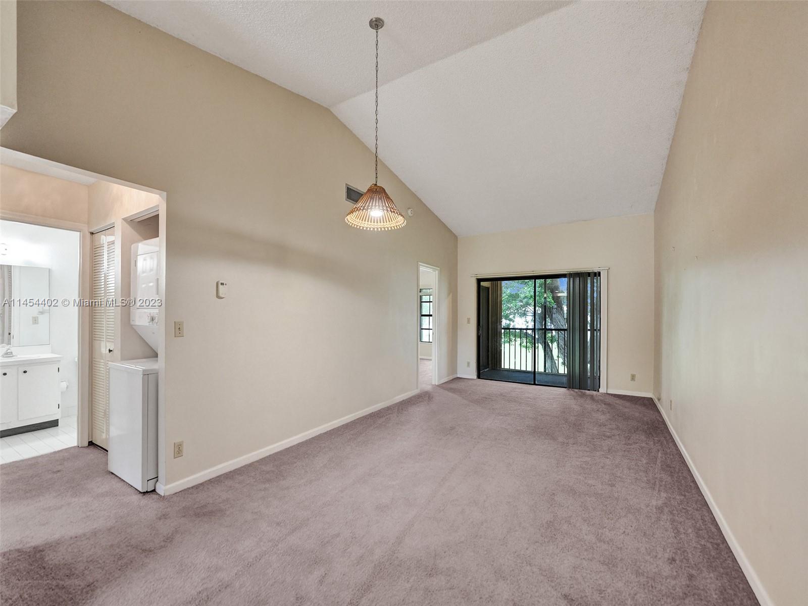 321 Olivewood Place, Unit O221 Boca Raton, FL 33431 - Photo 7 of 56 a view of an empty room with a window