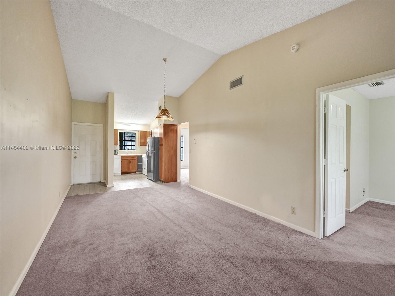 321 Olivewood Place, Unit O221 Boca Raton, FL 33431 - Photo 8 of 56 a view of a big room with closet and windows