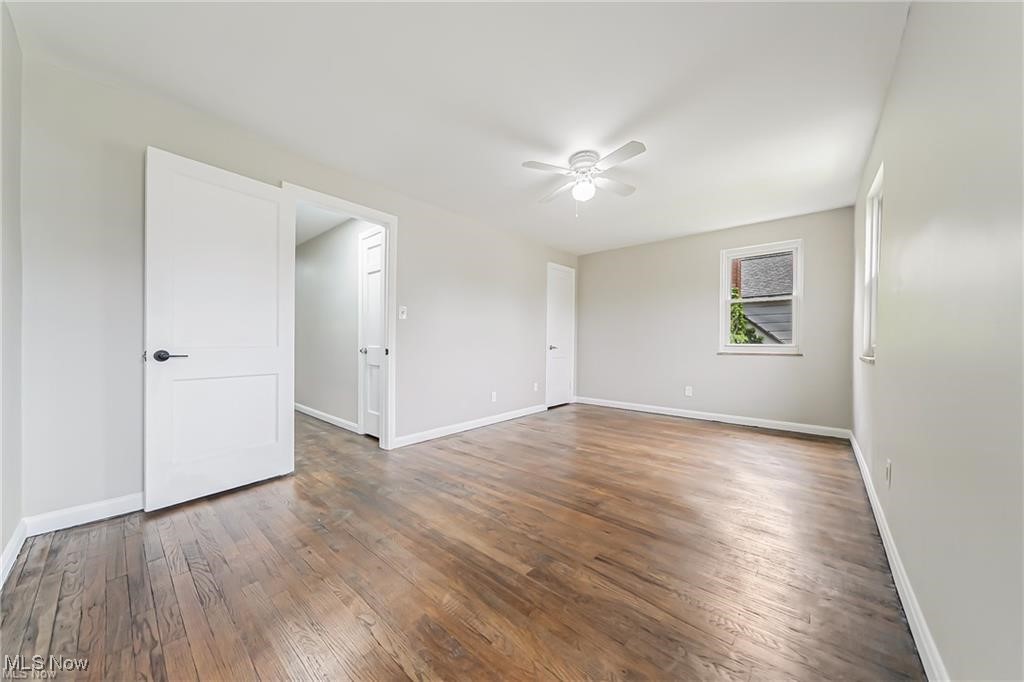 3837 Mayfield Road Cleveland, OH 44121 - Photo 17 of 29 Spare room featuring wood-type flooring and a ceiling fan