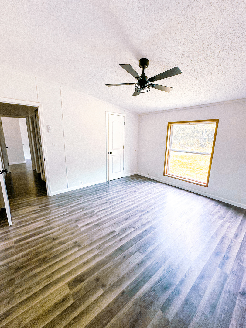 4920 Mt Moriah Road Galatia, IL 62935 - Photo 31 of 33 a view of empty room with wooden floor and fan