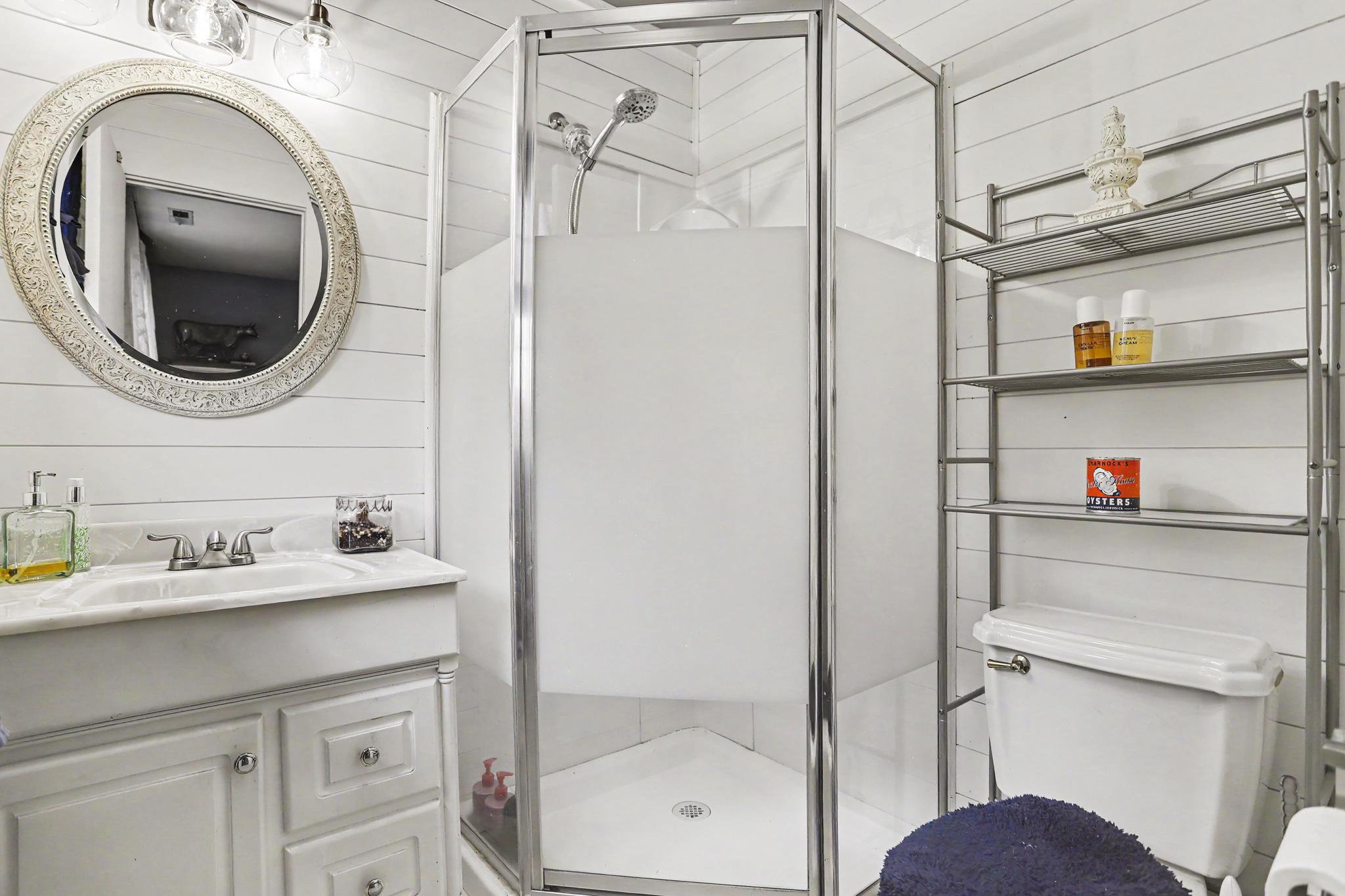 2226 Harney Road Littlestown, PA 17340 - Photo 19 of 40 a bathroom with a sink a mirror and shower