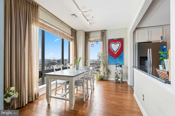 a view of a dining room with furniture window and wooden floor