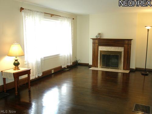 194 Jaycox Road Avon Lake, OH 44012 - Photo 2 of 16 Living room with fireplace and gleaming hardwood floors