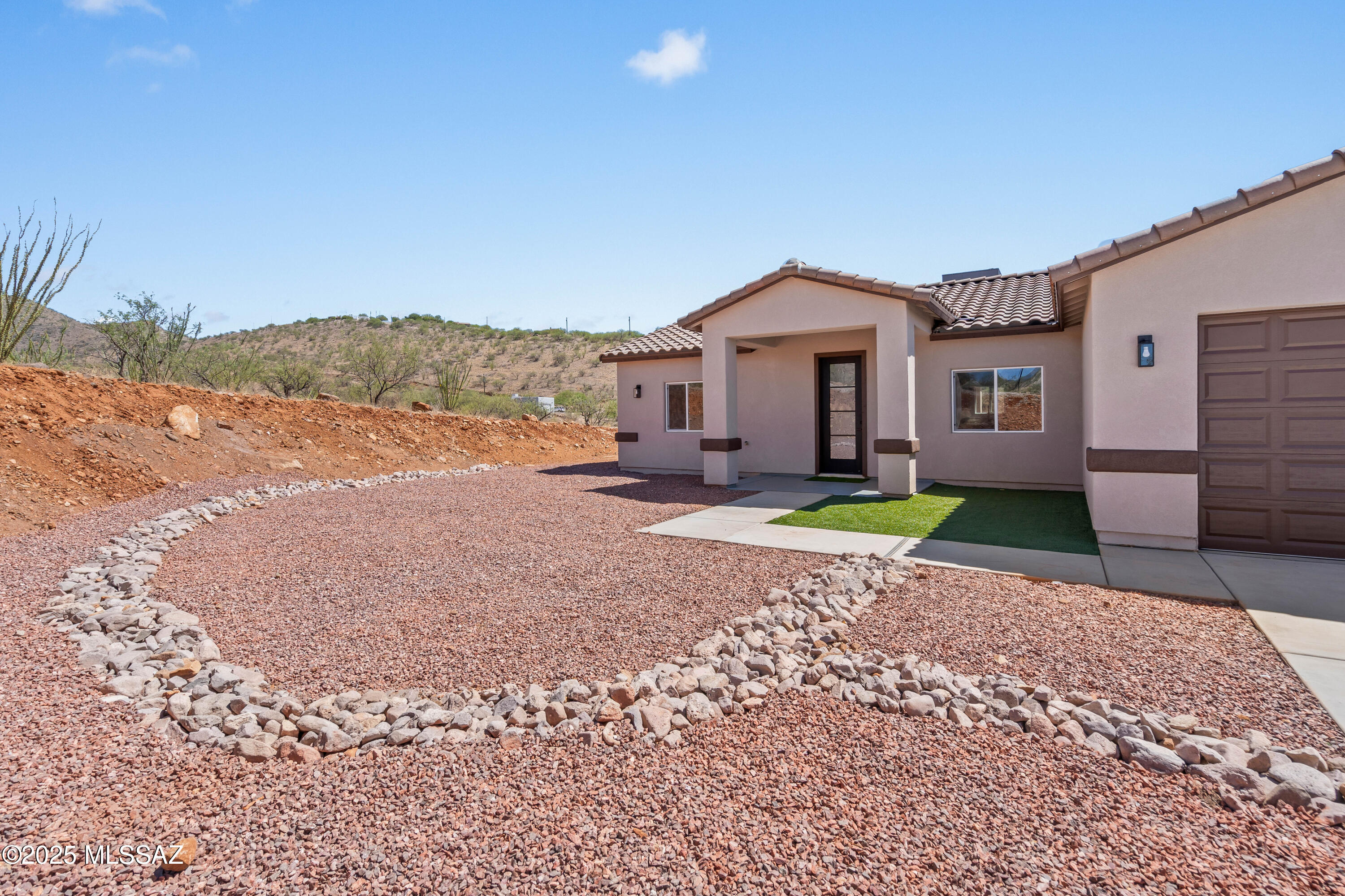 1667 Ave Calamar Rio Rico, AZ 85648 - Photo 4 of 33 a house view with a backyard space