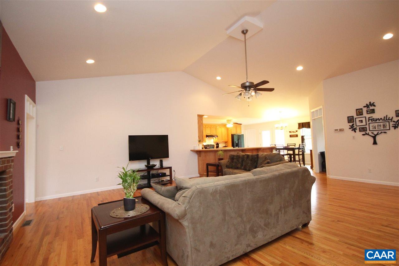 1566 Bybee Road Louisa, VA 23093 - Photo 11 of 34 a living room with furniture and a flat screen tv