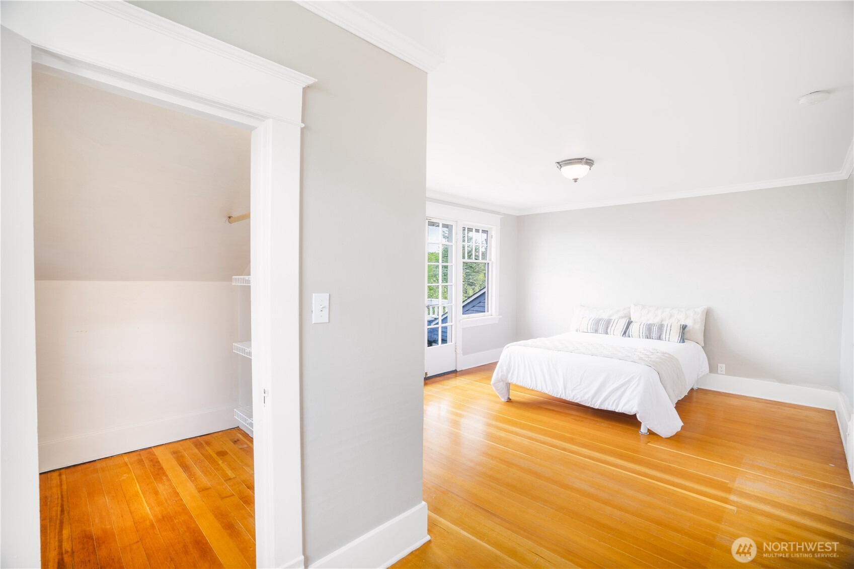 712 33rd Street Everett, WA 98201 - Photo 16 of 29 a bedroom with a bed and wooden floor