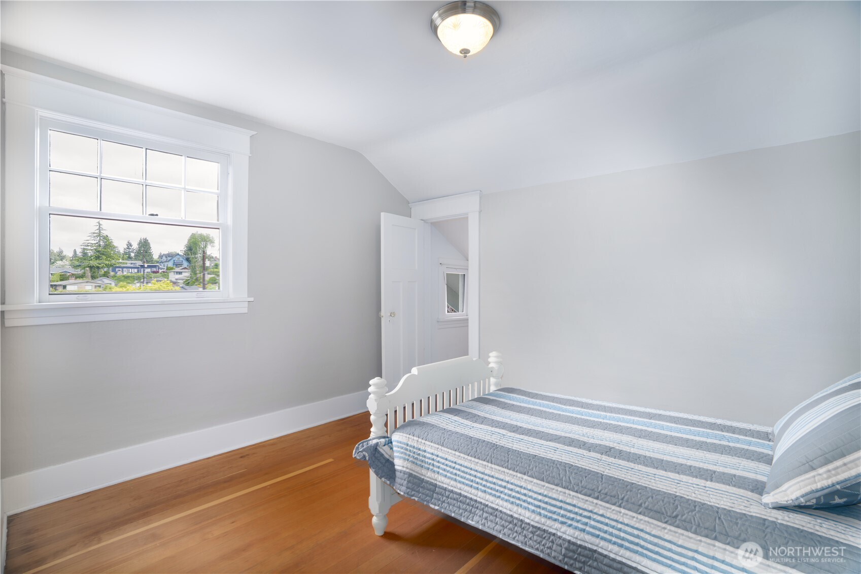 712 33rd Street Everett, WA 98201 - Photo 18 of 29 a bedroom with a bed and a window