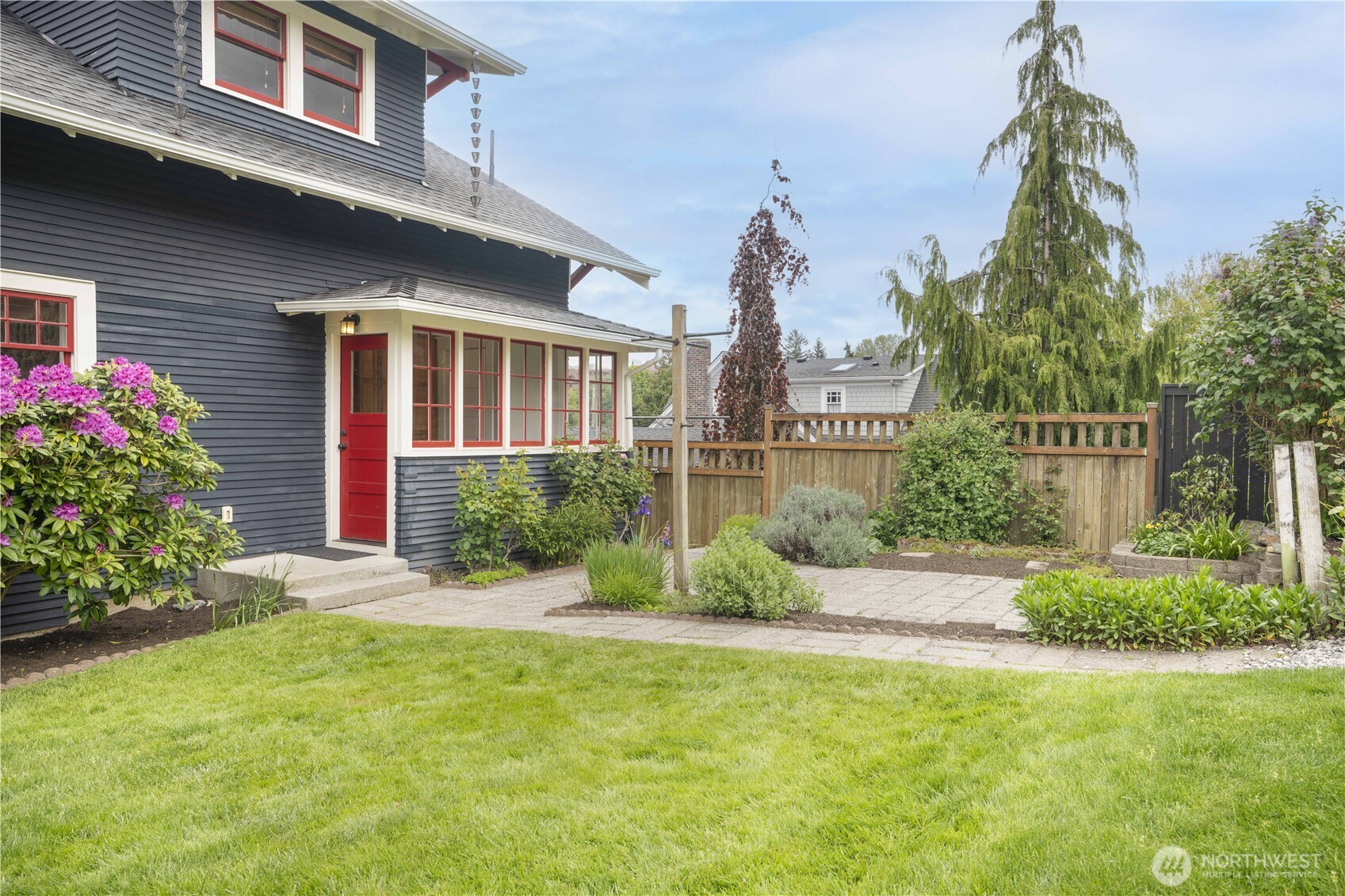 712 33rd Street Everett, WA 98201 - Photo 22 of 29 a front view of a house with a yard and potted plants