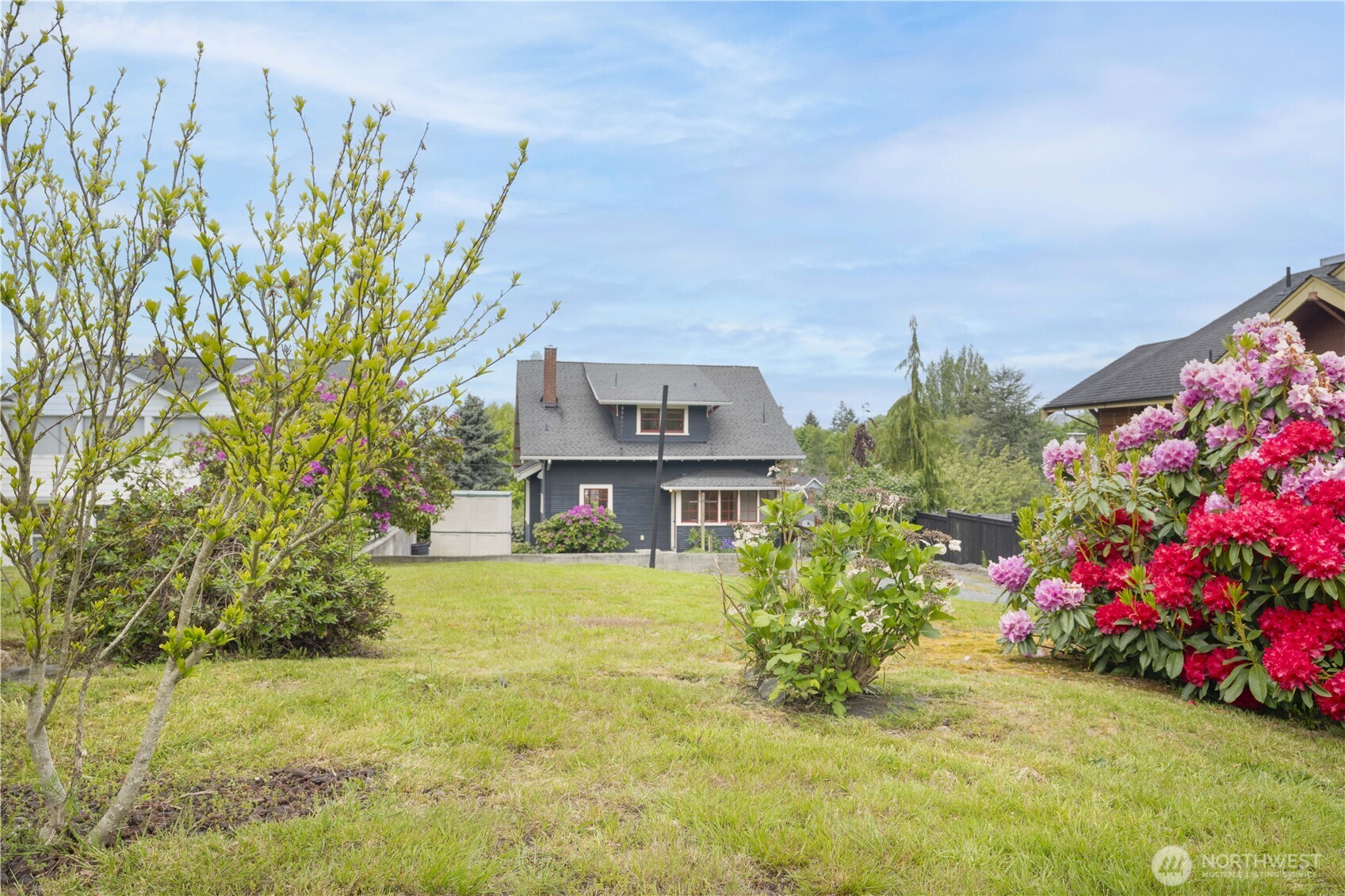 712 33rd Street Everett, WA 98201 - Photo 24 of 29 a view of a house with a big yard and potted plants