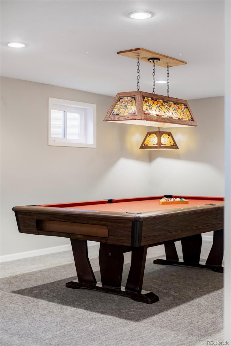 3406 South Stuart Street Denver, CO 80236 - Photo 24 of 34 a room with a table and window