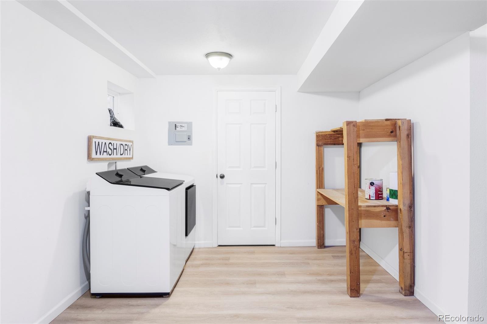 3406 South Stuart Street Denver, CO 80236 - Photo 28 of 34 a utility room with dryer and washer