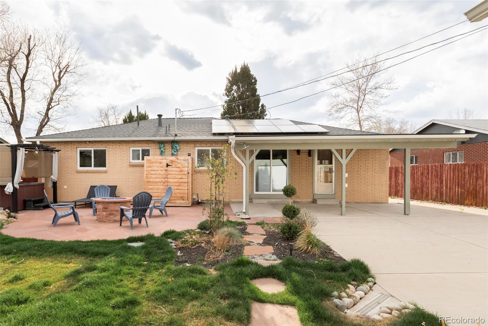 3406 South Stuart Street Denver, CO 80236 - Photo 29 of 34 front view of a house with a patio