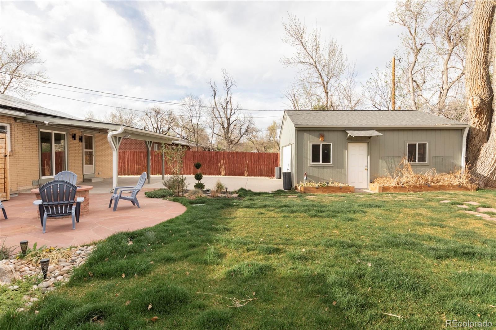 3406 South Stuart Street Denver, CO 80236 - Photo 30 of 34 a view of a house with backyard and sitting area