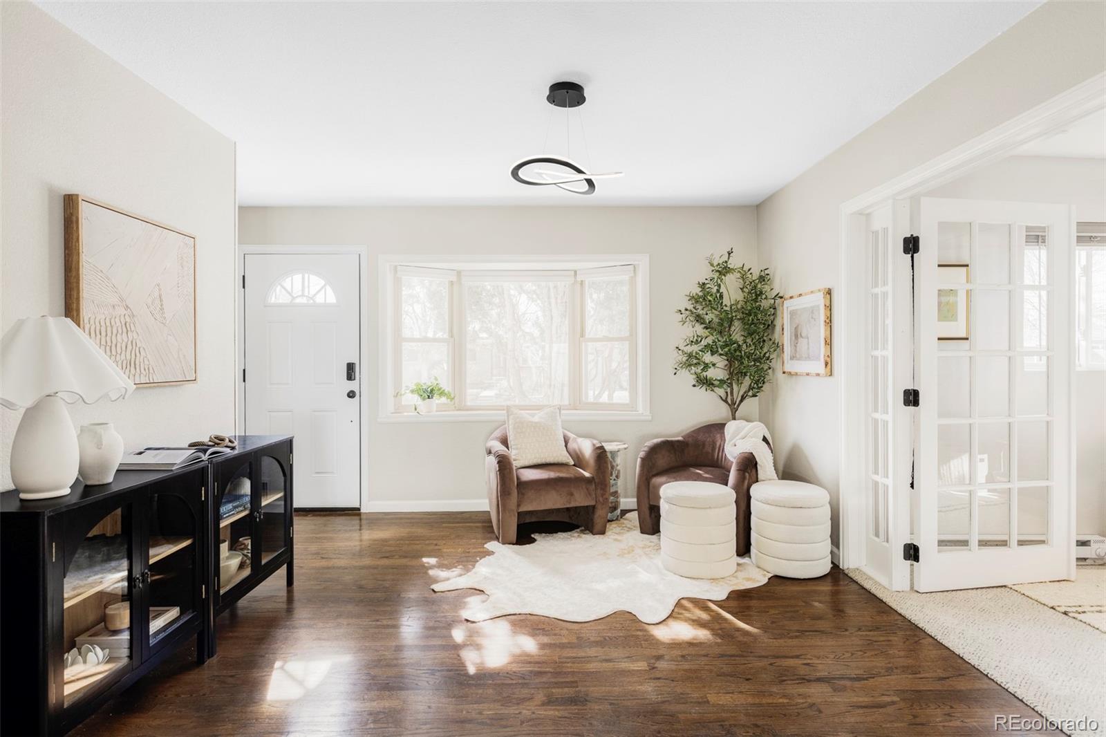 3406 South Stuart Street Denver, CO 80236 - Photo 3 of 34 a living room with furniture